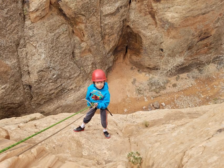 From Moab: Half-Day Canyoneering Adventure in Entrajo Canyon - Downclimb, shimmy, and chimney: learning the moves inside a slot canyon
