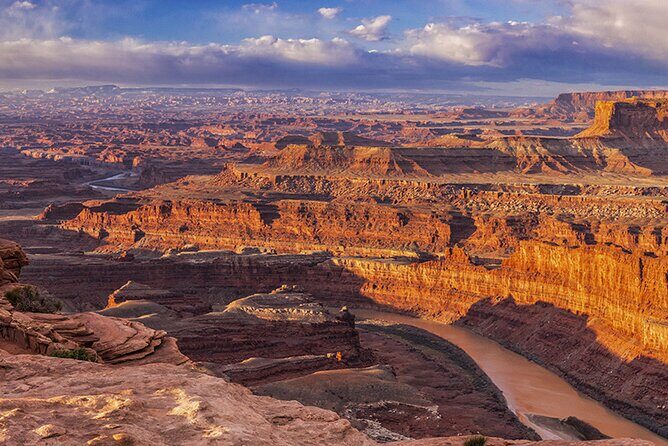 Sunrise photography in Dead Horse Point and Canyonlands National Park - Corona Arch near Moab: a bonus arch stop if timing allows